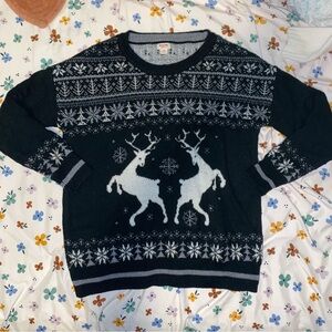 Cozy black winter holiday sweater with deer and snowflakes